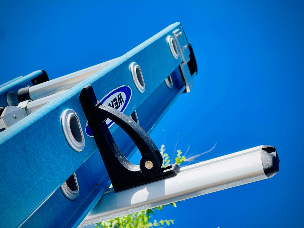 drop down ladder rack sliding stop