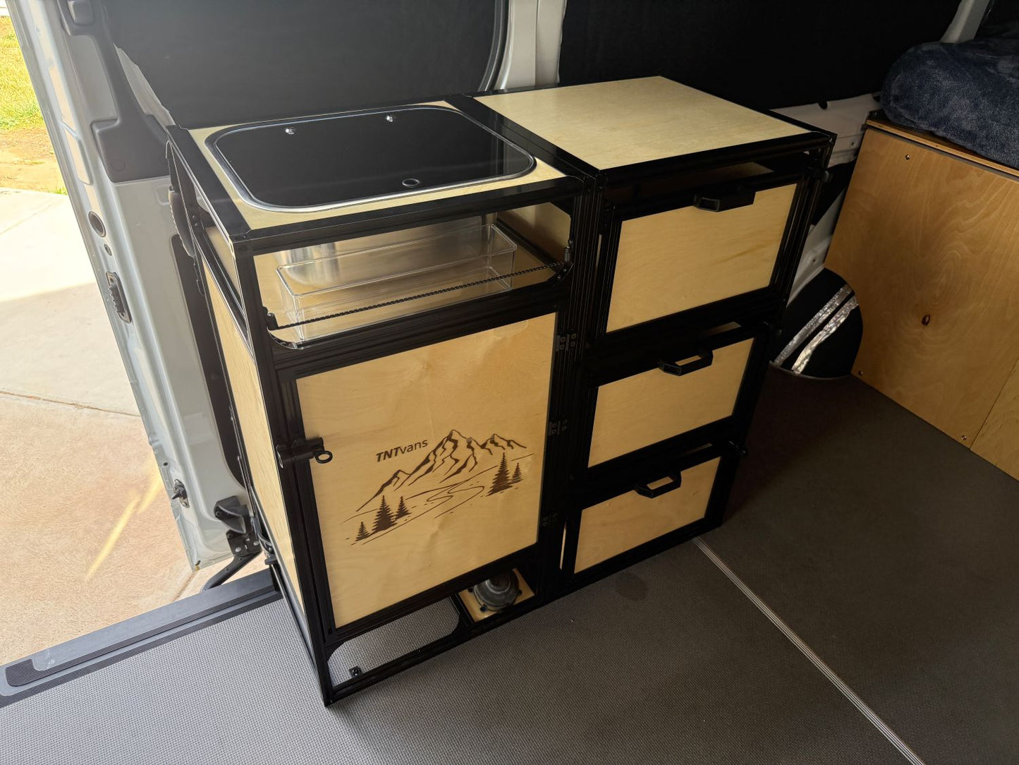 van kitchen kit in campervan with shelving and drawers