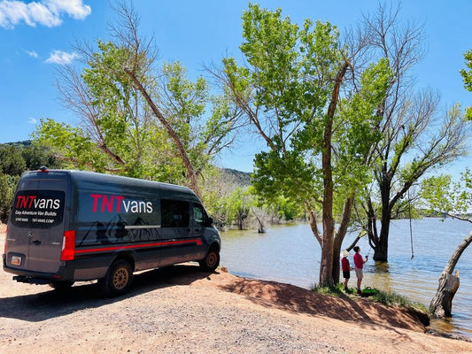 Sprinter camper van by a lake, building a camper van