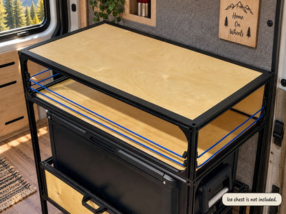 countertop tight of camper van conversion inside van with carpet walls and wood floors with ice chest slide tray