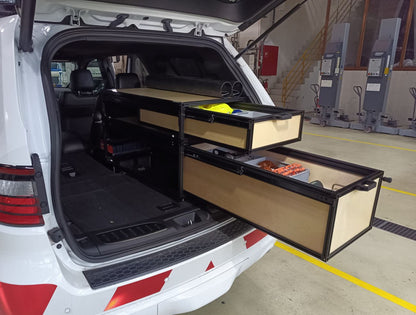 white dodge durango suv with open cargo drawers