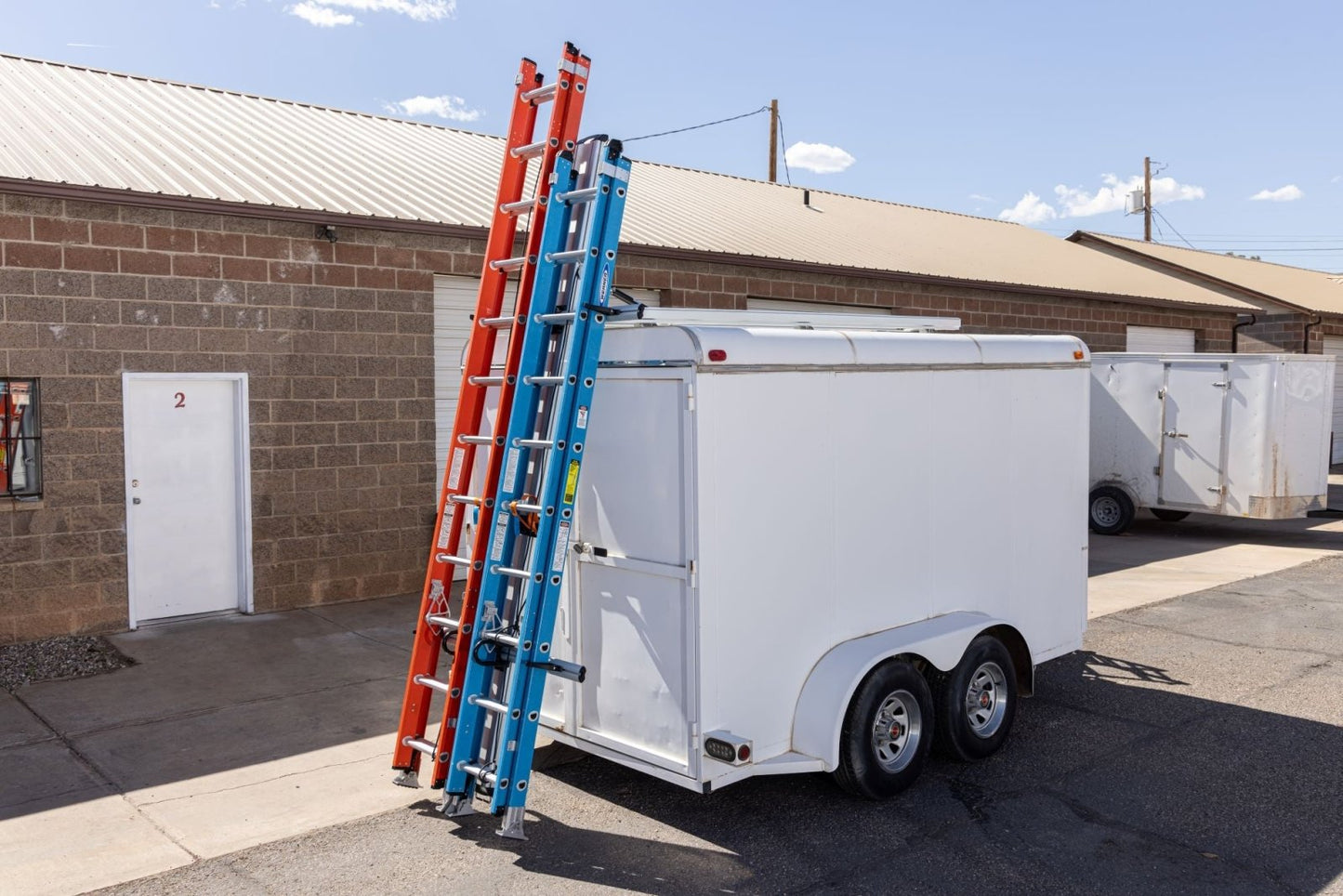 enclosed cargo trailer drop down ladder rack, down position, rear view
