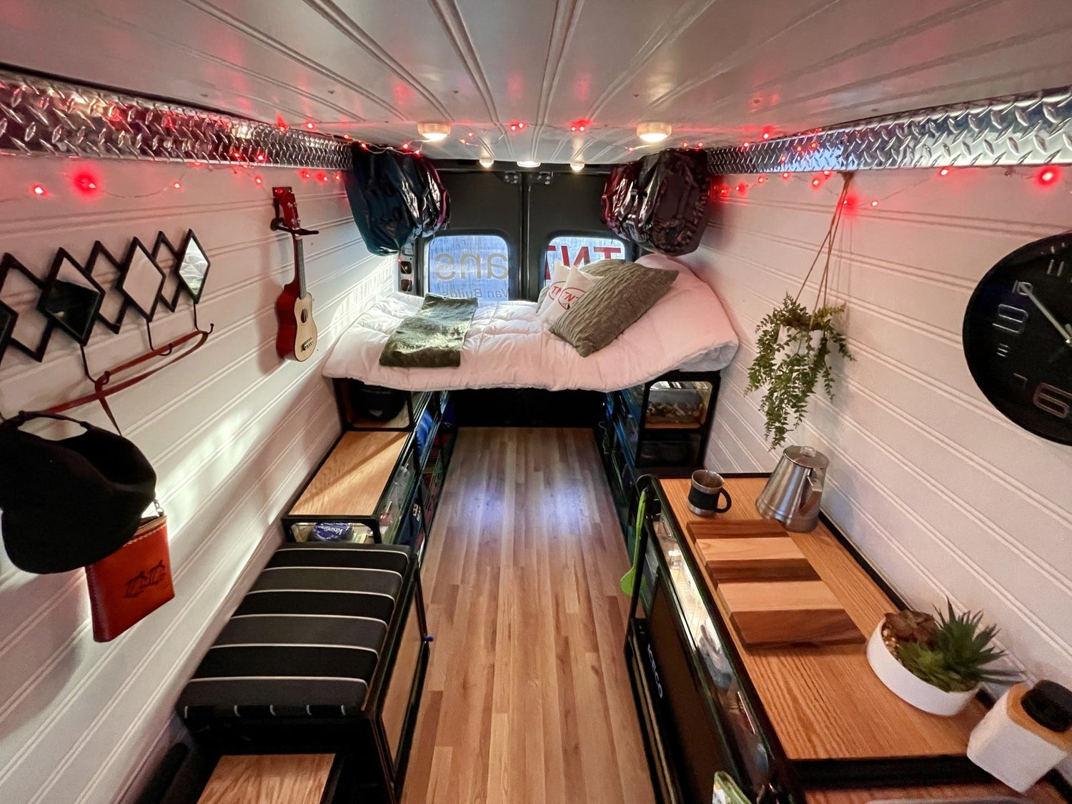 van kitchen in camper van conversion with red lights