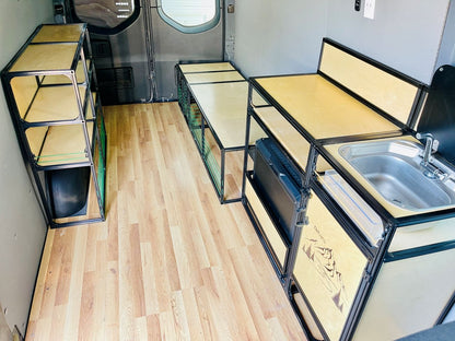 campervan conversion with shelving and room for motorcycle
