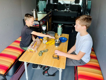 sprinter van dinette bench set over wheel wells with cushions