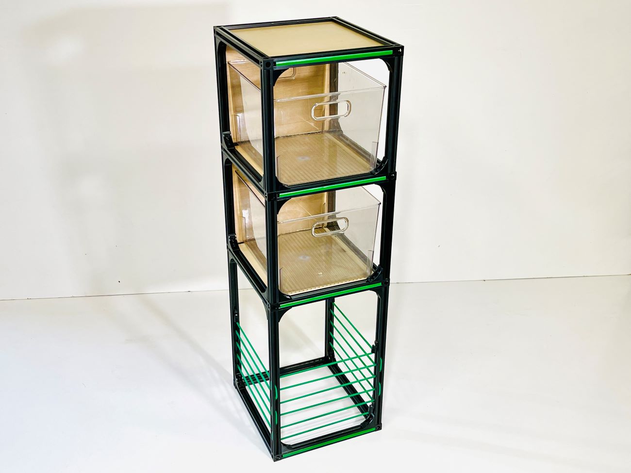 camper van storage unit with clear bins on shelves, green