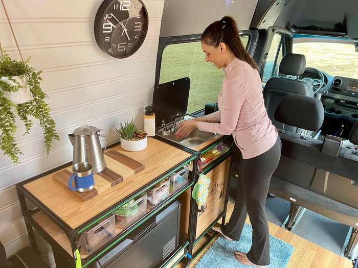 camper van kitchen unit with self contained sink system washing hands