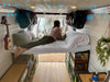 laying in camper van conversion bed